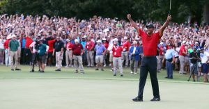 a-cast-of-thousands-joins-tiger-woods-on-his-victory-march.jpg